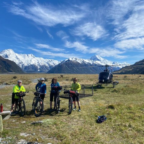 a group of people sitting in a field