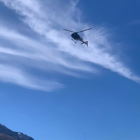 a large airplane flying high up in the air