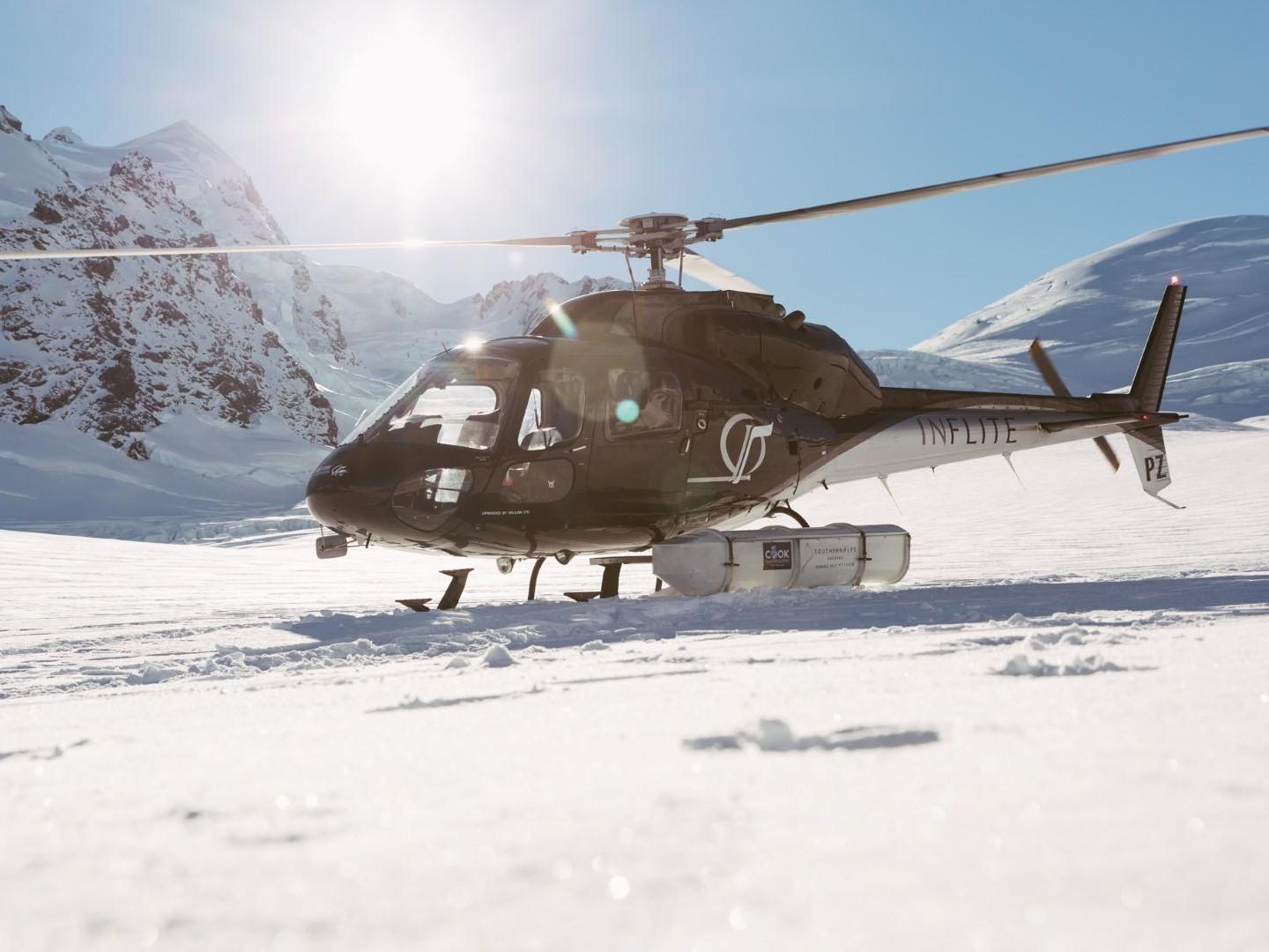 Helicopter lands on Mt Cook in New Zealand