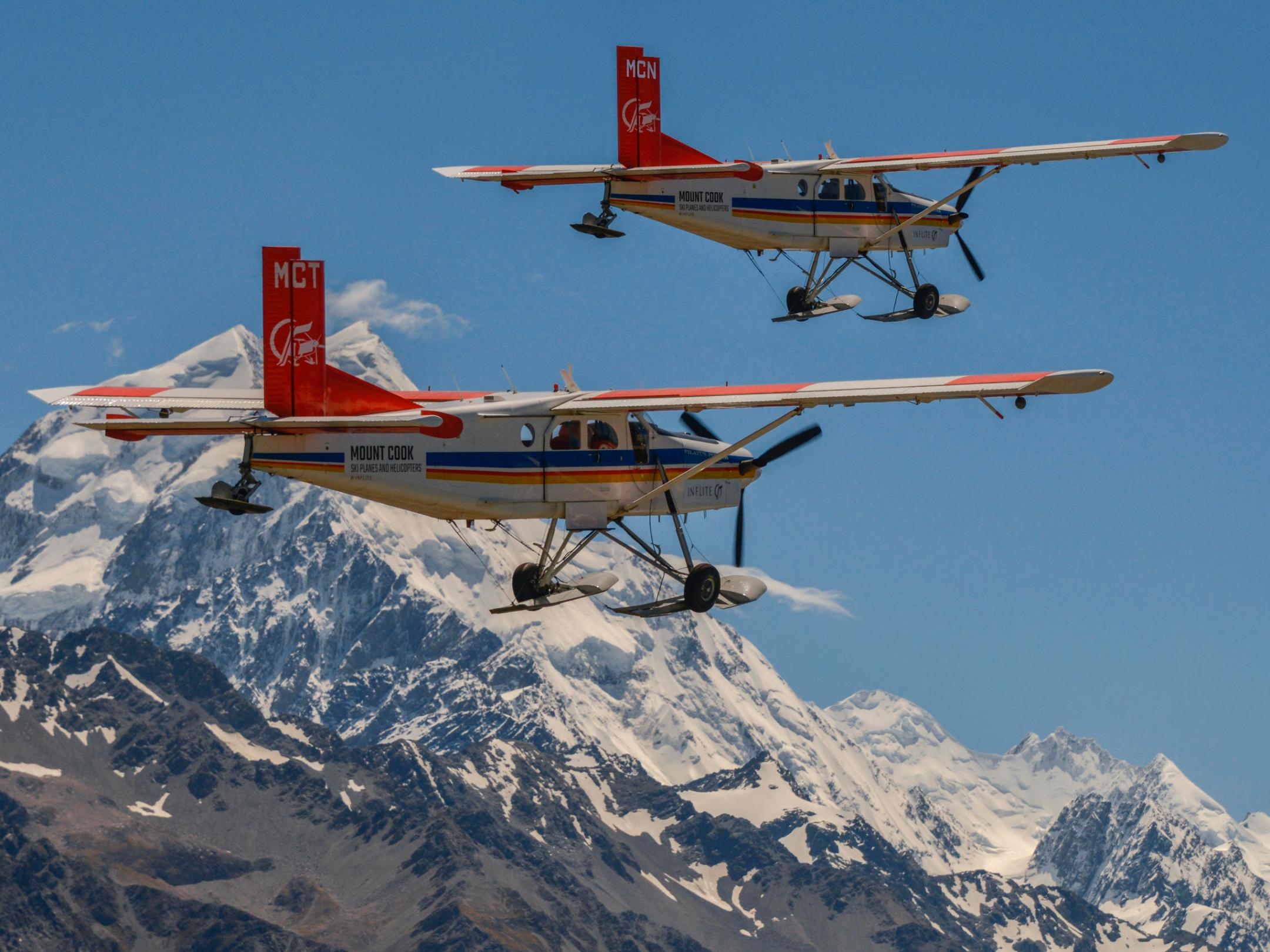 2 ski planes flying over Mt Cook in New Zealand