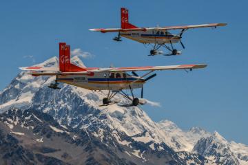 2 ski planes flying over Mt Cook in New Zealand