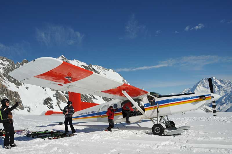 id1775pic1 4 people getting on board on ski planes