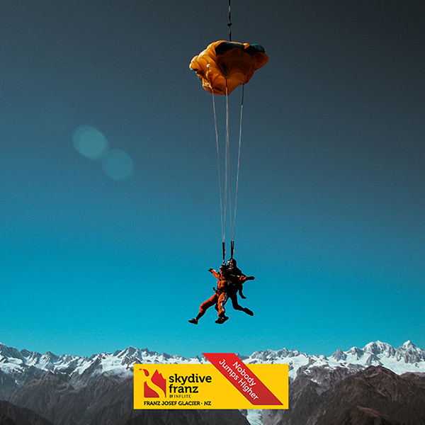 2 people doing tandem parachute