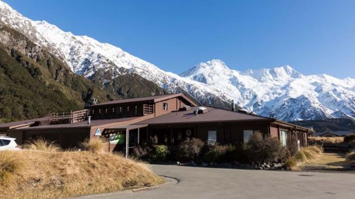 Massive house with mountain background