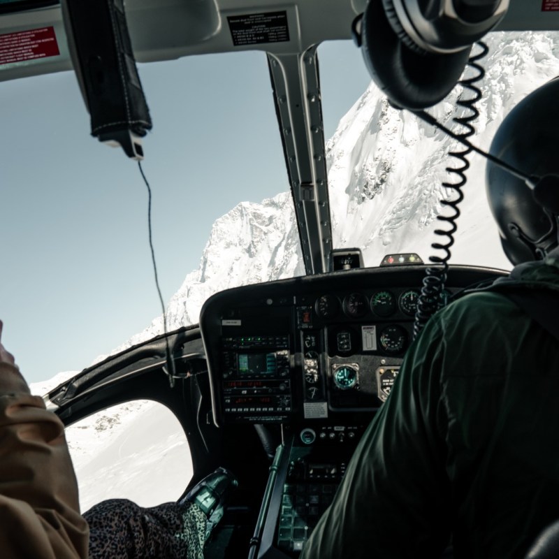 Helicopter Cockpit looking at Snowy Mountains