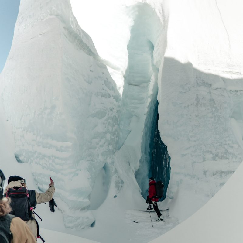 Skier in front of Ice Cave Entrance