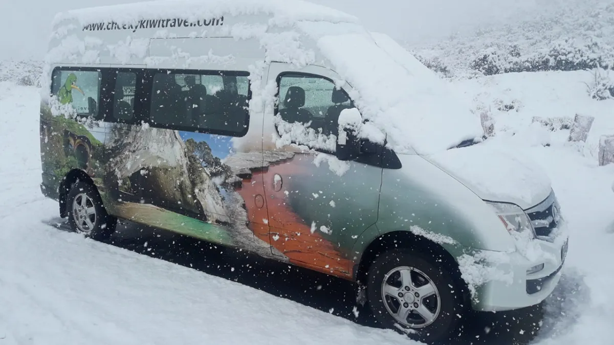 f5773cff_17a3_49cd_aabd_13fc6095ec87 a car covered in snow