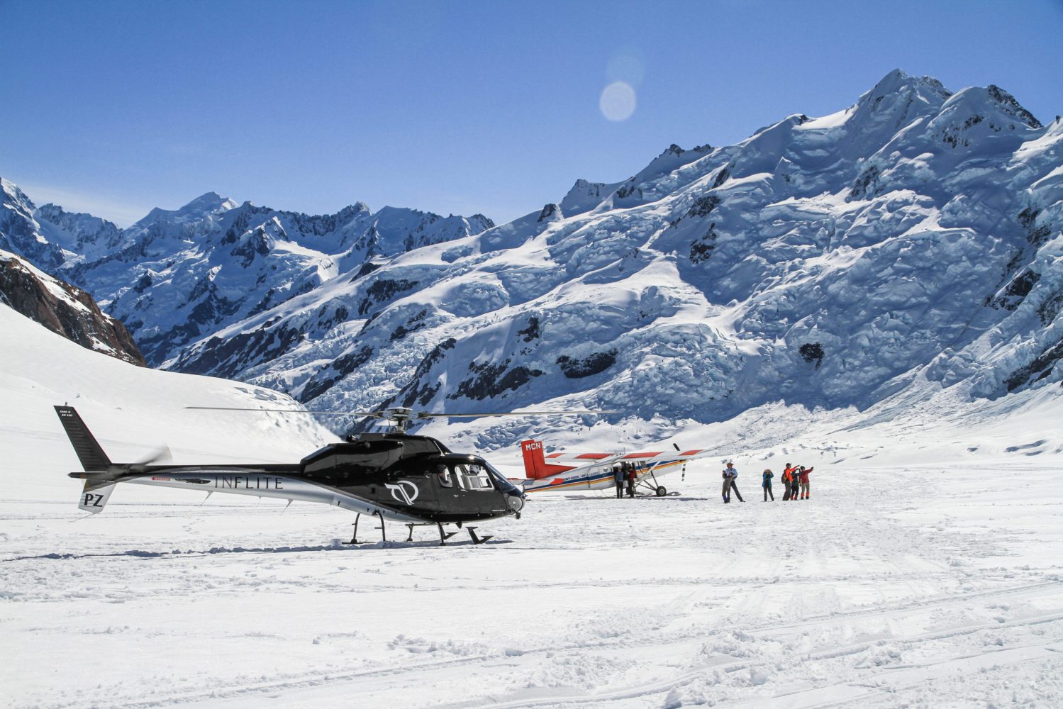 Mt Cook Ski Plane and Helicopter on a Mountain Peak at Winter