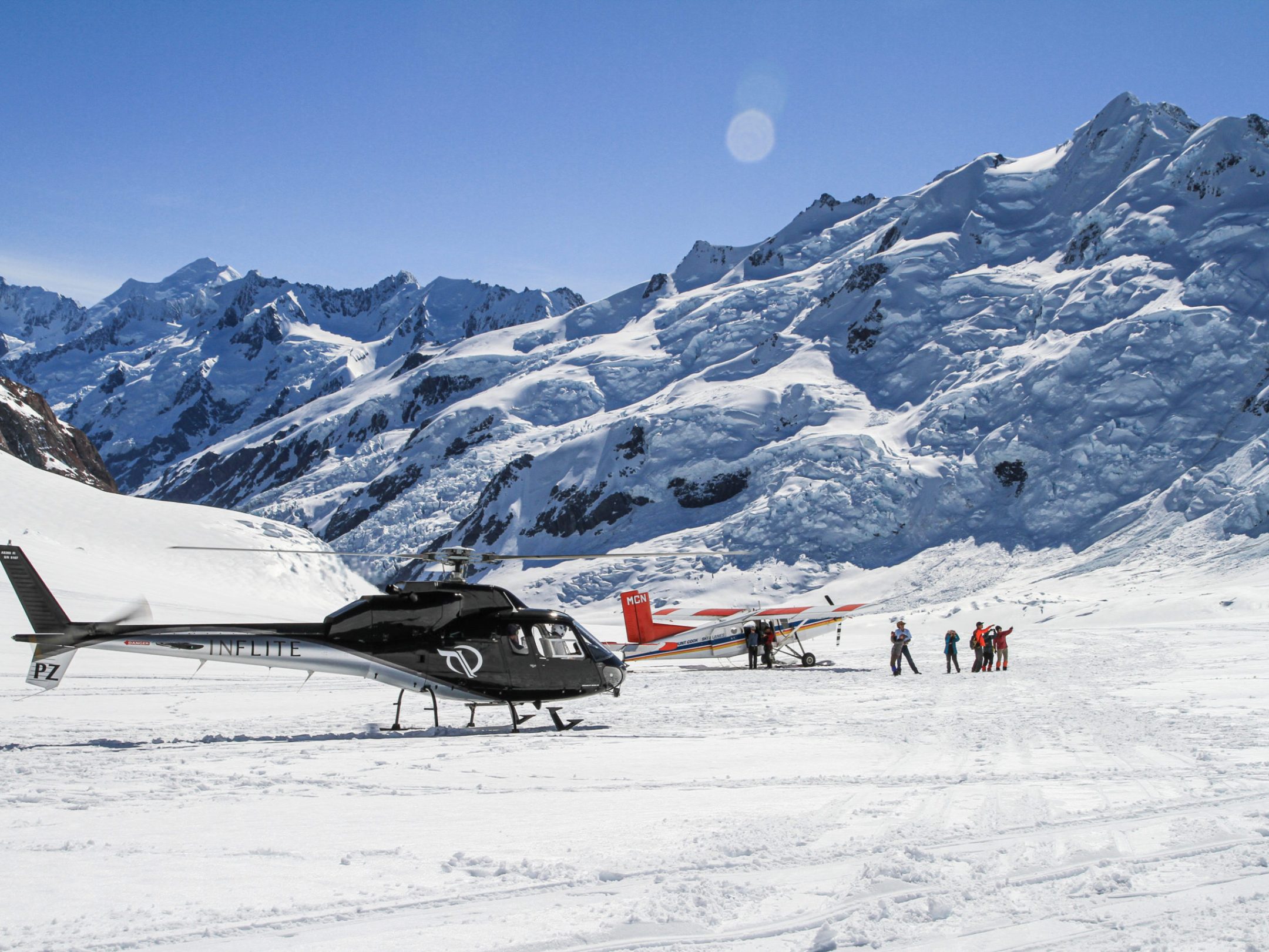 Mt Cook Ski Plane and Helicopter on a Mountain Peak at Winter