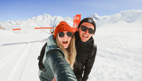 a woman posing in a snow covered slope