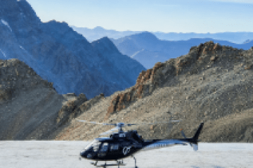 a man standing on top of a mountain