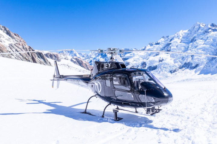 a person riding skis down a snow covered mountain