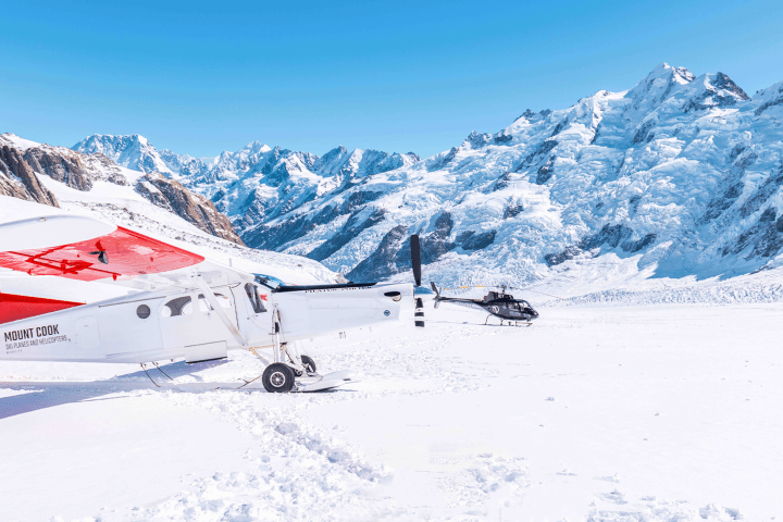 Mt. Cook Ski Plane and Helicopter in the Snow on a Mountain Peak