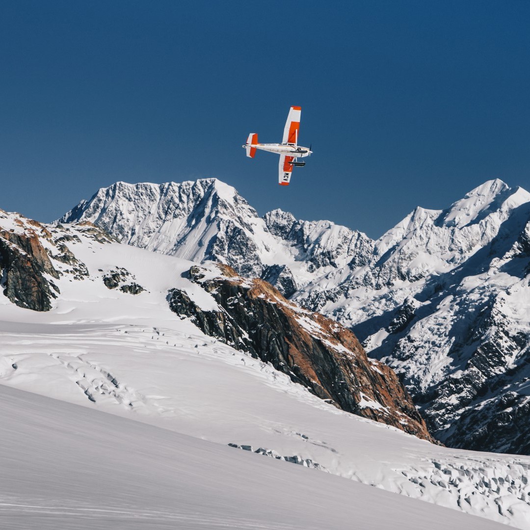 Ski plane flies over mountains in south island new zealand