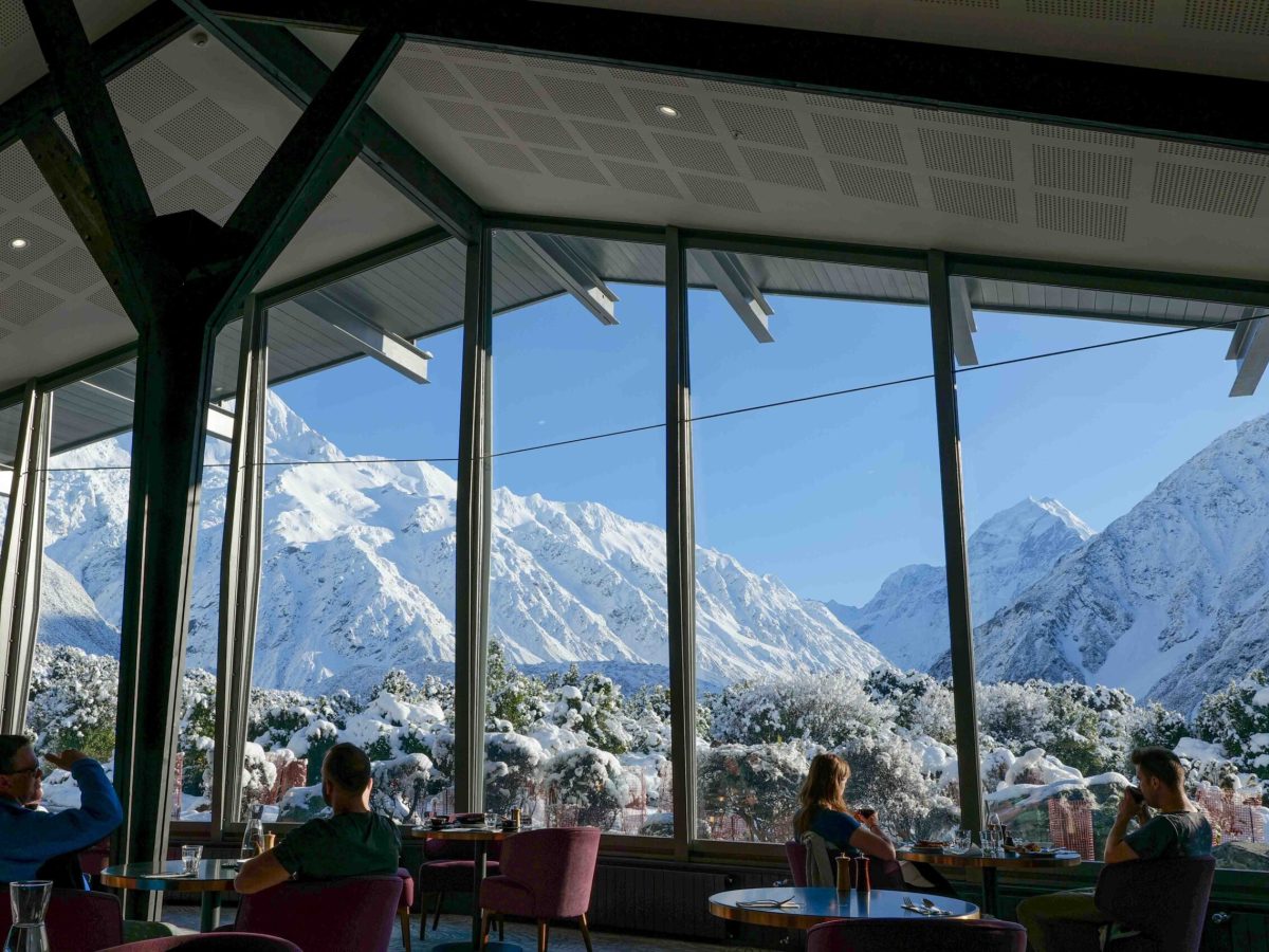 a group of people standing on top of a mountain