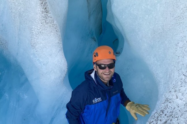 a man that is standing in the snow