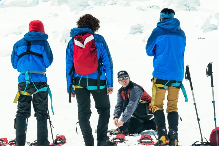 a group of people that are standing in the snow