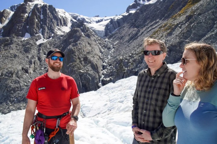 a couple of people that are standing in the snow