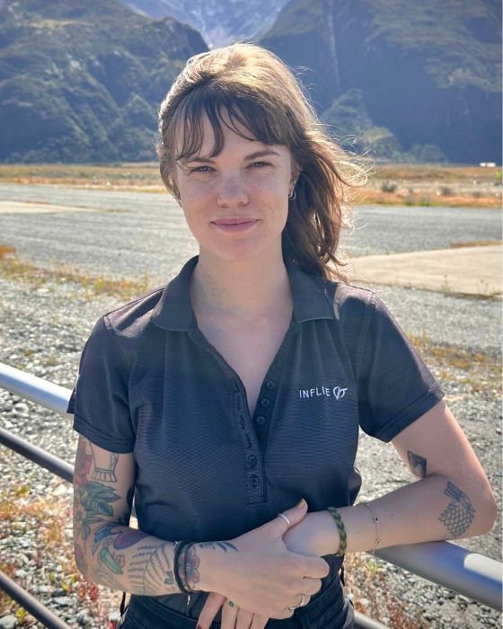 a person standing in front of a mountain