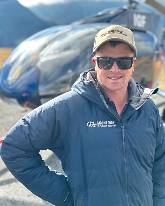 a man wearing sunglasses taking a selfie